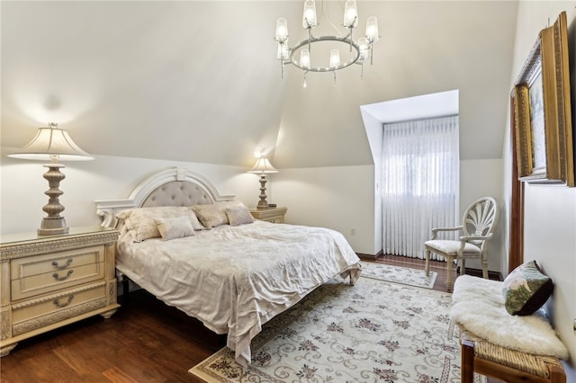 bedroom featuring lofted ceiling, wood-type flooring, and a notable chandelier