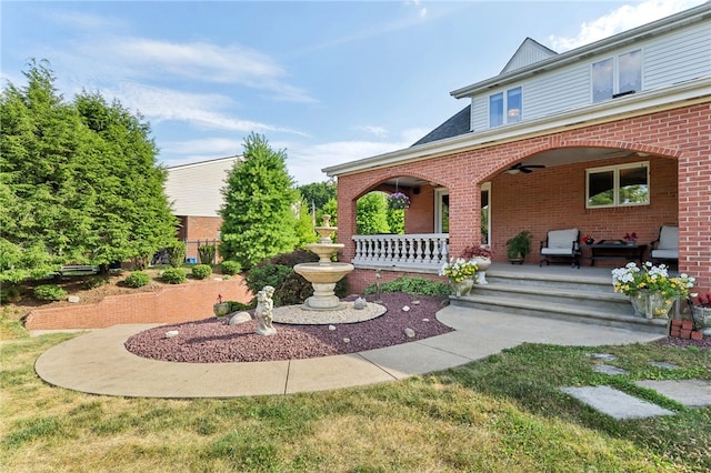 exterior space with ceiling fan