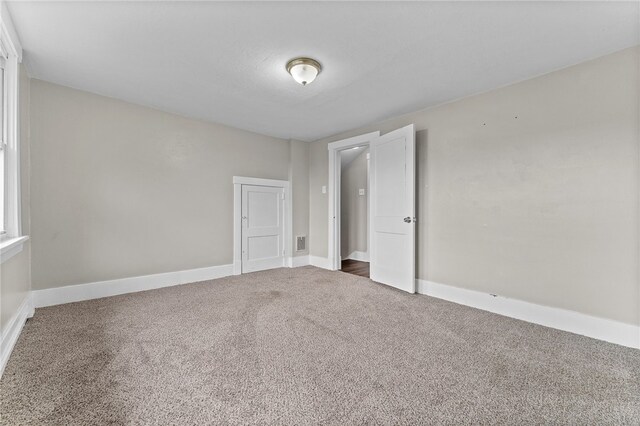 unfurnished bedroom with carpet floors