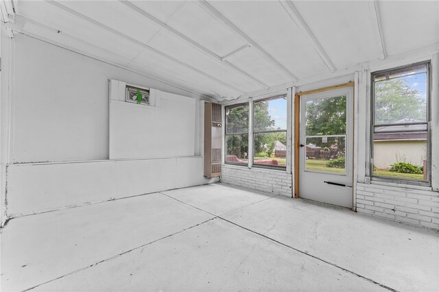 unfurnished sunroom with plenty of natural light