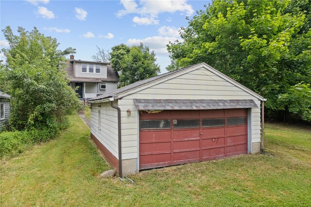 garage with a lawn