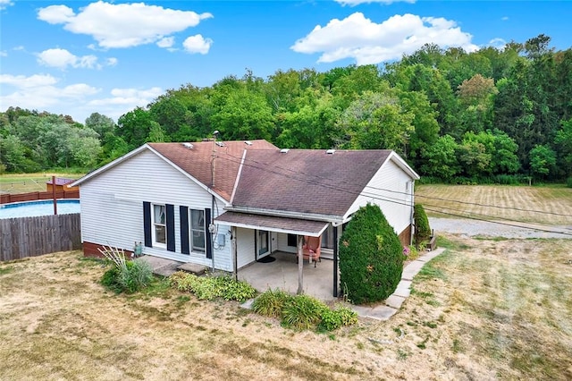 back of property with a patio