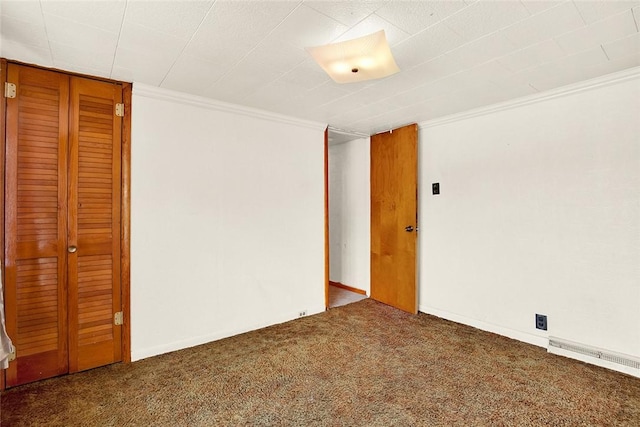 carpeted empty room with ornamental molding