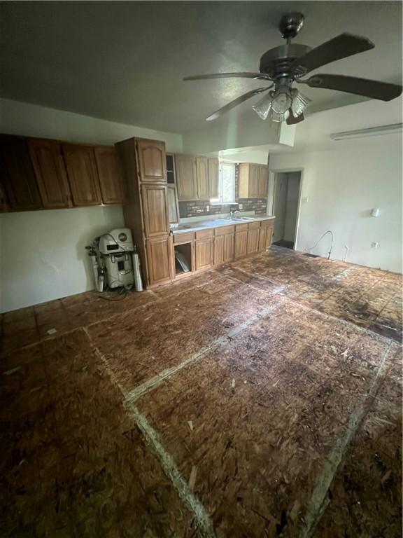 kitchen featuring sink and ceiling fan