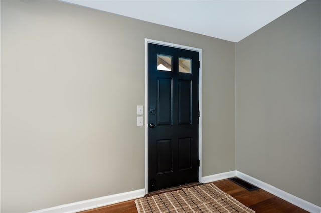 entryway featuring dark wood-type flooring