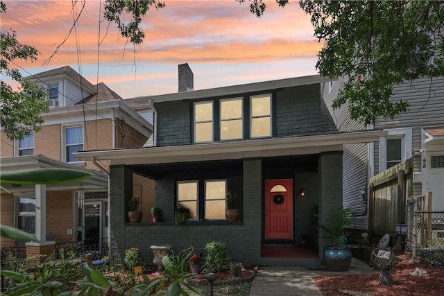 view of front of property featuring covered porch