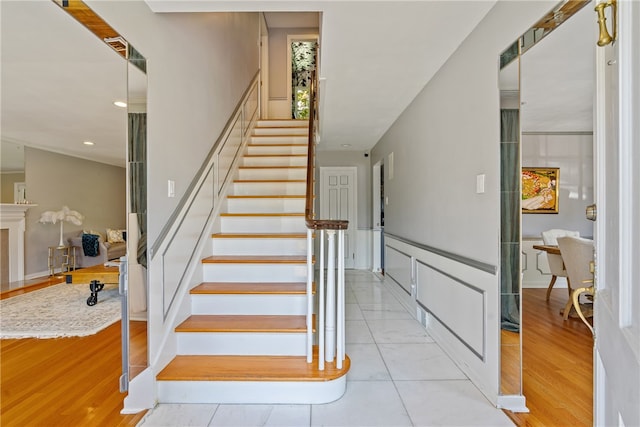 stairs featuring light tile patterned floors