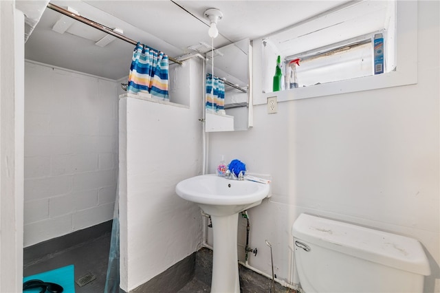 bathroom featuring sink and toilet