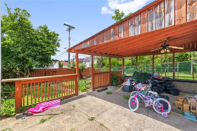 view of patio featuring ceiling fan