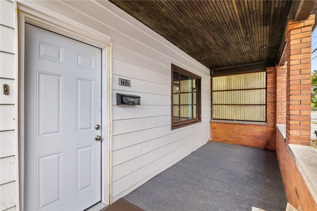 property entrance featuring covered porch