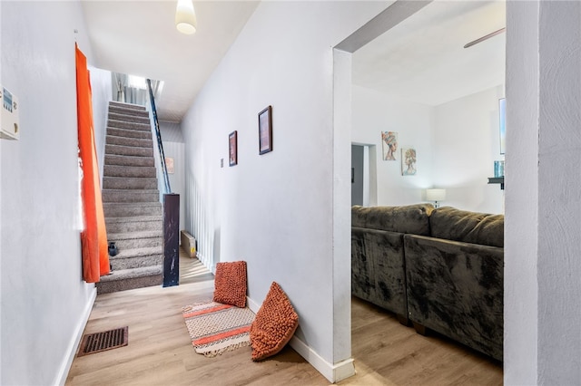 hall with light hardwood / wood-style floors