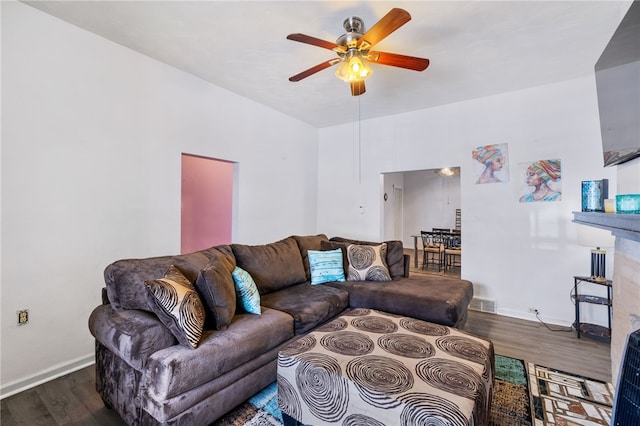 living room featuring ceiling fan and wood-type flooring