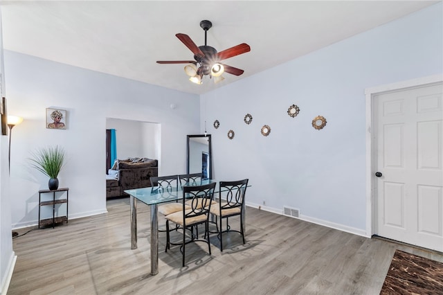 dining room featuring light hardwood / wood-style flooring and ceiling fan