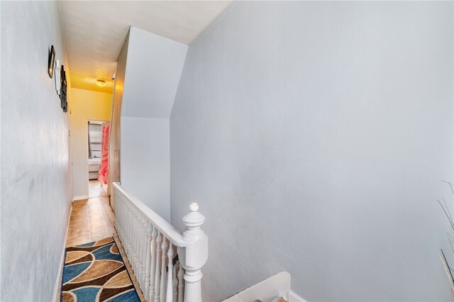 stairs featuring light tile patterned flooring