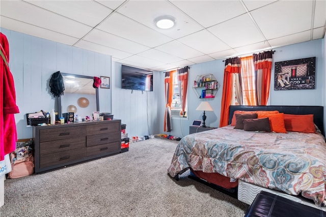 carpeted bedroom featuring a paneled ceiling