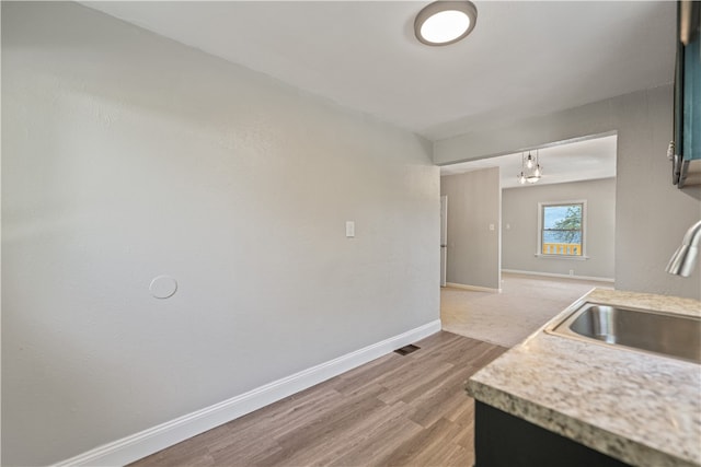 kitchen featuring sink and hardwood / wood-style floors