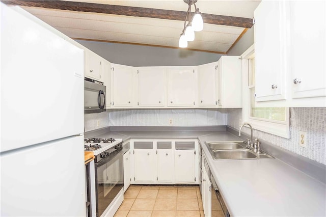 kitchen featuring white appliances, light tile patterned floors, white cabinets, lofted ceiling with beams, and sink