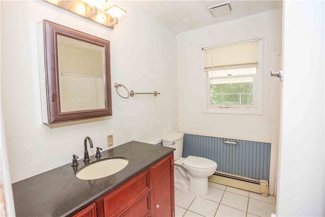 bathroom featuring tile patterned floors, vanity, a baseboard heating unit, and toilet