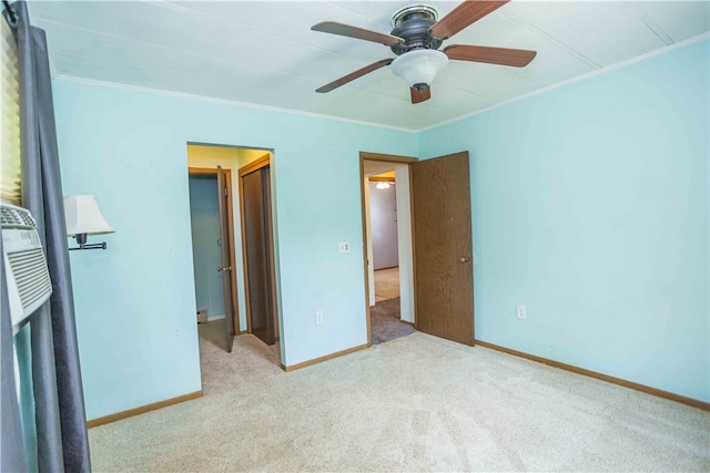 unfurnished bedroom with carpet, ceiling fan, and ornamental molding