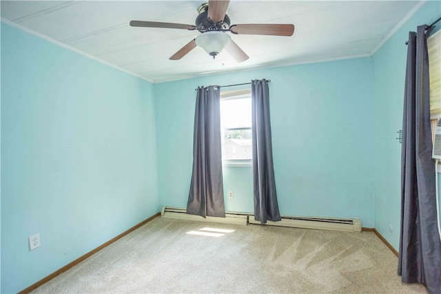 carpeted empty room featuring ceiling fan and ornamental molding