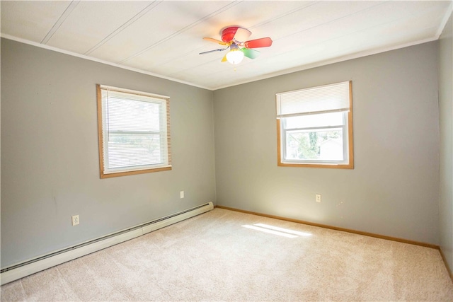 unfurnished room with baseboard heating, a wealth of natural light, ceiling fan, and carpet flooring