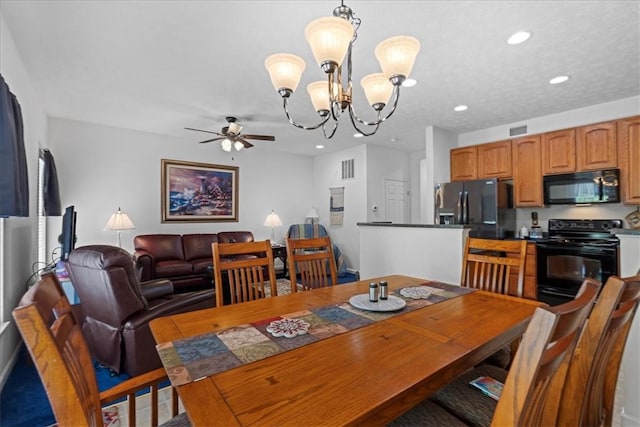 dining area with ceiling fan with notable chandelier