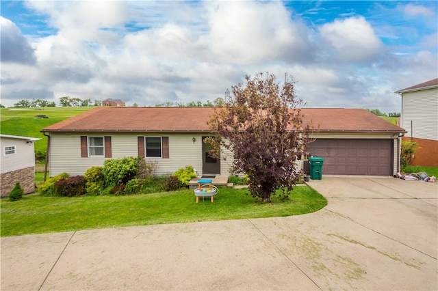 single story home with a garage and a front lawn