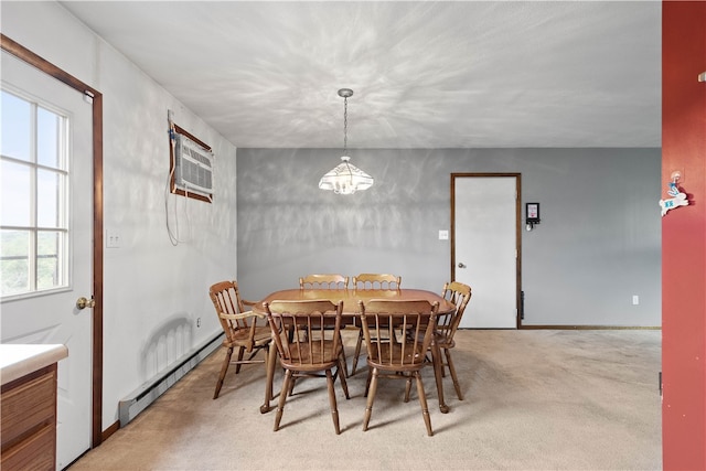 carpeted dining area featuring an inviting chandelier, baseboard heating, and an AC wall unit