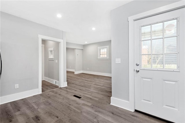 entryway with recessed lighting, baseboards, and wood finished floors