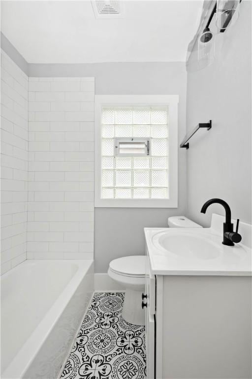 full bath with tile patterned floors, visible vents, toilet, baseboards, and vanity