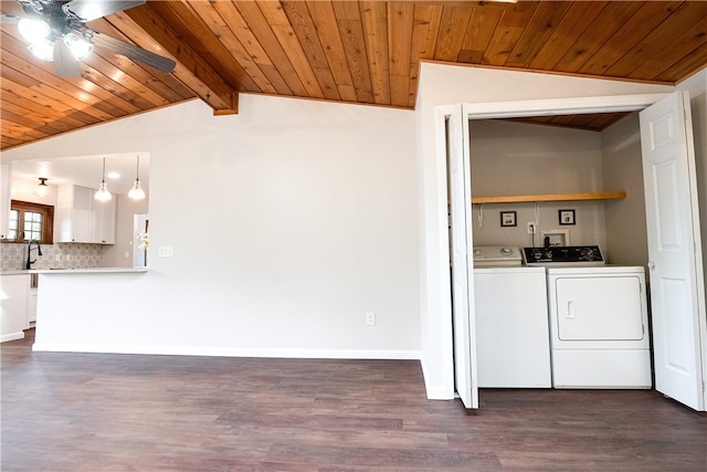 laundry room featuring ceiling fan, dark hardwood / wood-style floors, washing machine and dryer, and wooden ceiling