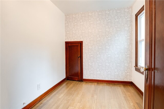 spare room with light hardwood / wood-style flooring