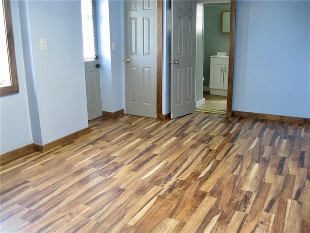 unfurnished bedroom featuring wood-type flooring