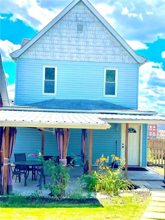 3 N 5th St, Youngwood, PA 15697 - view of front facade featuring a porch and fence