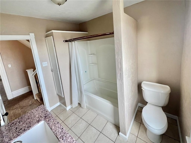 bathroom featuring tile patterned flooring, shower / tub combo, and toilet