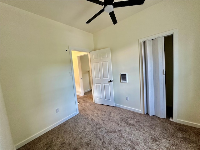 unfurnished bedroom with ceiling fan, a closet, and light colored carpet