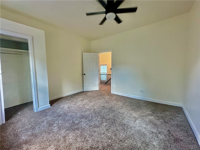 unfurnished bedroom featuring ceiling fan and carpet floors