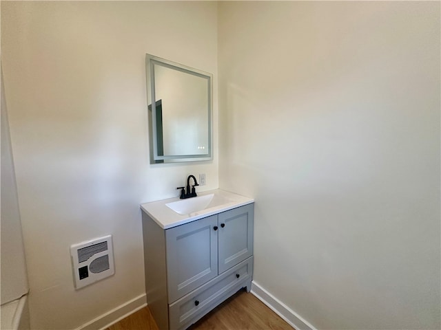 bathroom featuring vanity and hardwood / wood-style floors