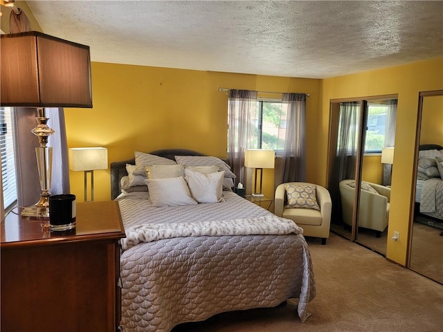 carpeted bedroom featuring a textured ceiling