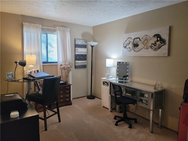 carpeted office space with a textured ceiling