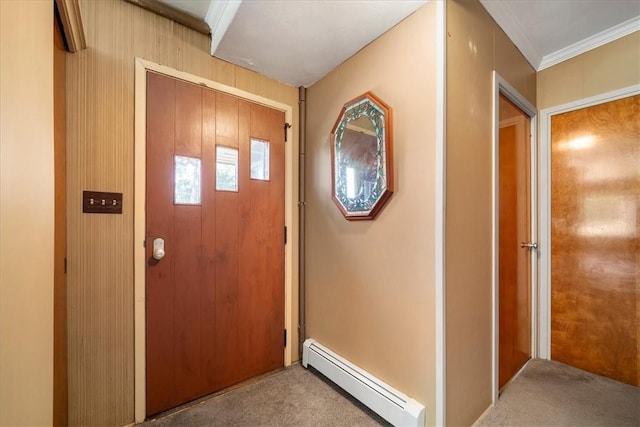 entryway with a baseboard heating unit, crown molding, and light colored carpet