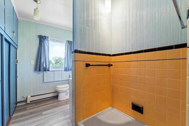 bathroom with a baseboard radiator, hardwood / wood-style floors, toilet, walk in shower, and ornamental molding