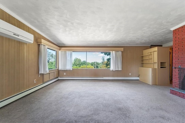 unfurnished living room featuring a brick fireplace, ornamental molding, a wall mounted AC, and wooden walls