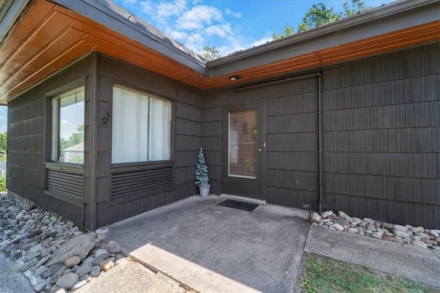 view of property exterior featuring a patio area