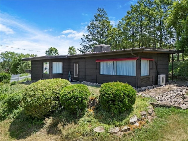 view of front of home with ac unit