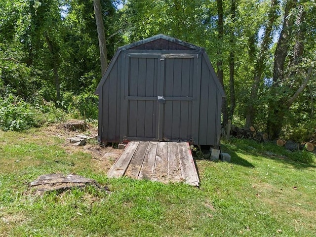 view of outdoor structure with a lawn