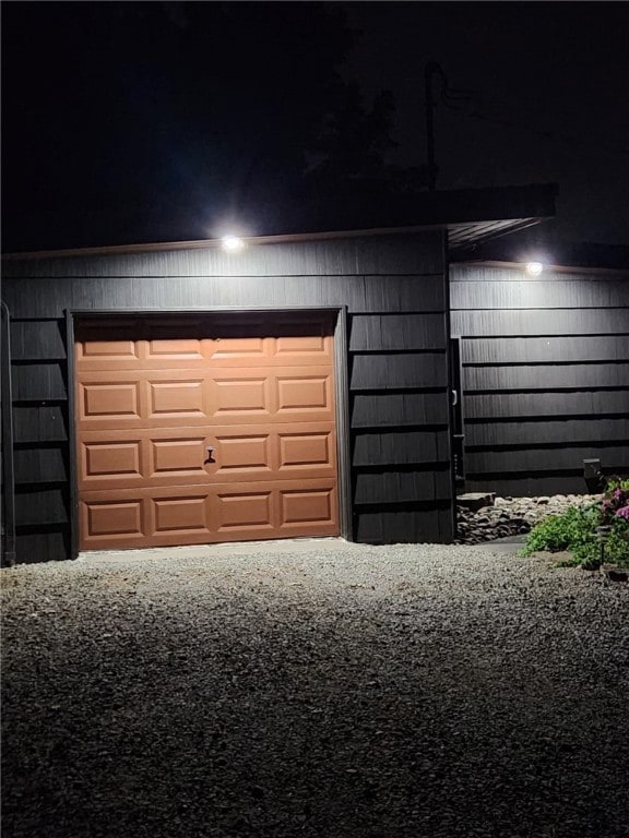 view of garage at night