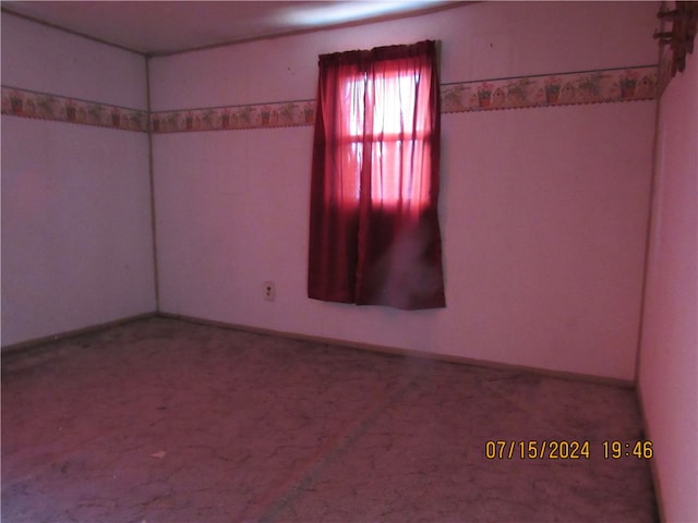 unfurnished room with carpet flooring