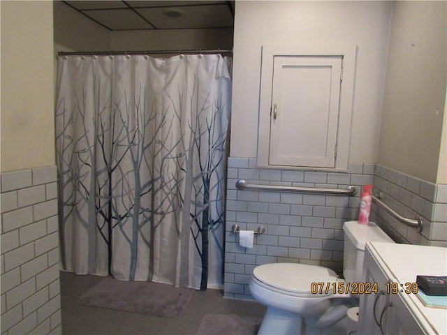 414 Middle Ave, Luzerne Twp, PA 15413 - bathroom featuring tile walls, a wainscoted wall, toilet, vanity, and a shower with shower curtain