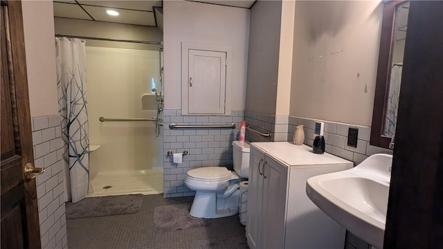 414 Middle Ave, Luzerne Twp, PA 15413 - bathroom with tile walls, a shower with curtain, tile patterned floors, toilet, and wainscoting